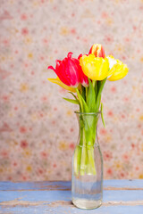 a bunch of tulips in a vase 