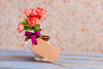 bunch of carnation for Mothers day with empty note