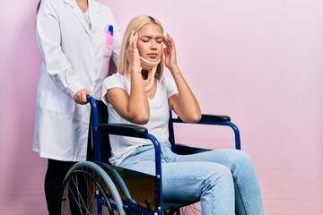 Beautiful blonde woman sitting on wheelchair with collar neck with hand on head for pain in head because stress. suffering migraine.