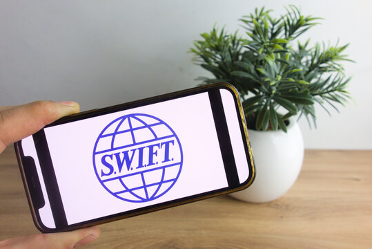 KONSKIE, POLAND - March 26, 2022: SWIFT - Society For Worldwide Interbank Financial Telecommunication Logo On Mobile Phone