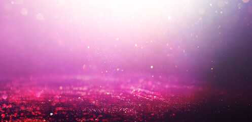 purple and pink glitter vintage lights background. defocused