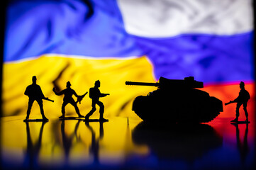 War between Russia and Ukraine, conceptual image of war using chess board, warring soldiers and...