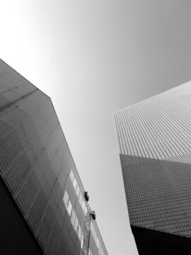 Grayscale photo of high-rise buildings in close-up