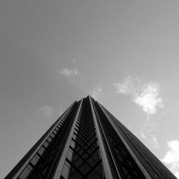 Grayscale photo of high-rise buildings in close-up