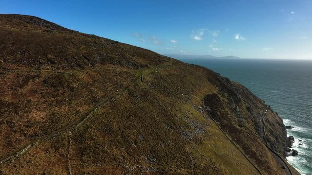 Ventry, Kerry, Ireland, March 2022. Drone ascends above the Dingle Peninsula while looking southeast across the North Atlantic Ocean with Carrigower and Kells in the background.
