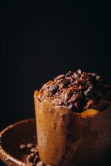 Chocolate muffin on black background
