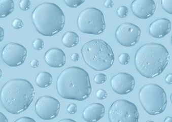 Blue doses of acid, hyaluronic moisturizing serum or gel on a monochrome background. Abstract backdrop pattern. Beauty product wallpaper. Cosmetics or healthcare protection concept.