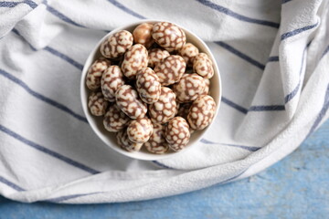 Chocolate truffles balls on a platter on a marble table, horizontal view from above, flat lay, free space