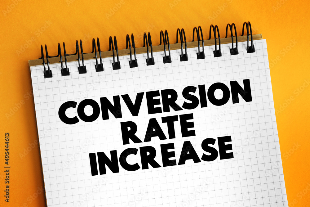 Aufkleber conversion rate increase text on notepad, concept background