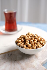 Roasted yellow chickpeas in wooden bowl
