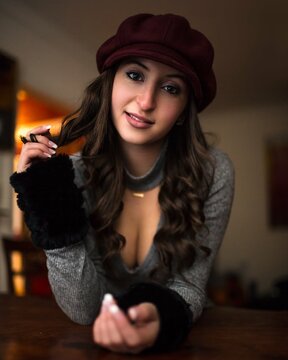 Portrait of young woman with red hat indoor