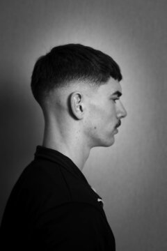 Side view portrait of young man in grayscale