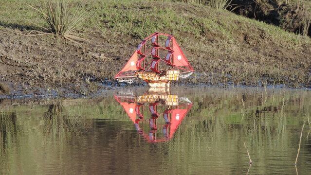 Small handmade boat on shoreline