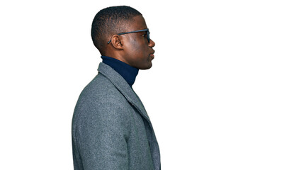 Young african american man wearing business clothes and glasses looking to side, relax profile pose...