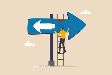 Change to opposite direction, hesitate business decision to change to better opportunity, conflict or reverse direction, career path concept, businessman paint opposite direction arrow on arrow sign. - obrazy, fototapety, plakaty