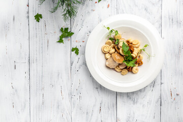 pickled champignon mushrooms with pepper and parsley on wooden background, banner, menu, recipe place for text, top view