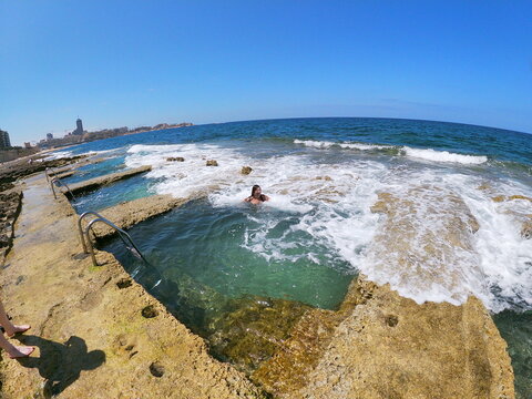 Woman swimming near seashore