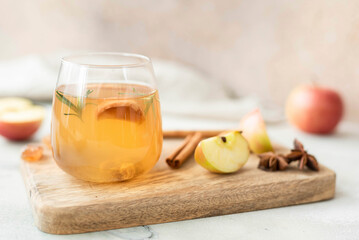 fruity apple tea with honey and cinnamon in a glass bottle