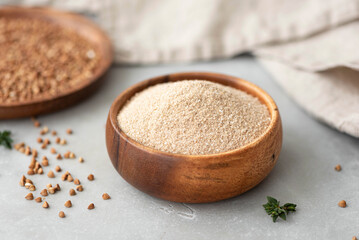 gluten-free homemade buckwheat flour in a wooden bowl, close-up