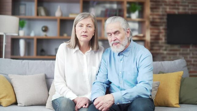 Portrait Gray Hair Senior Couple Elderly Person Patients Look At Camera And Listen Online Consultation Remotely. Older Families Listen Carefully To The Doctor Or Lawyer's Advice In Home Webcam View