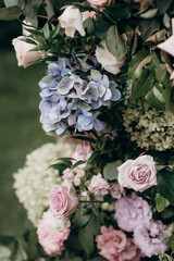 flower arrangement in delicate shades for the wedding ceremony