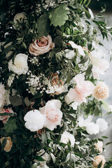 flower arrangement in delicate shades for the wedding ceremony