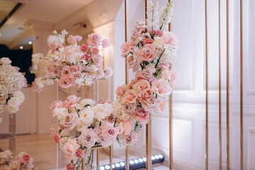 pink-white flower arrangements in the decor of the wedding ceremony