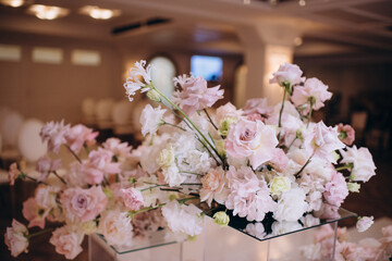 pink-white flower arrangements in the decor of the wedding ceremony