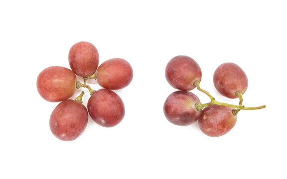 Red grapes placed on a white background, View from directly above.