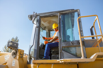 Experienced construction worker working hard at factory