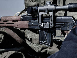 Military training. Soldier participates in a shooting training in a military facility. He is using an assault rifle to shoot with 7.62 x 39 caliber.