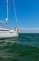 Senior couple relaxing on yacht sailing the ocean