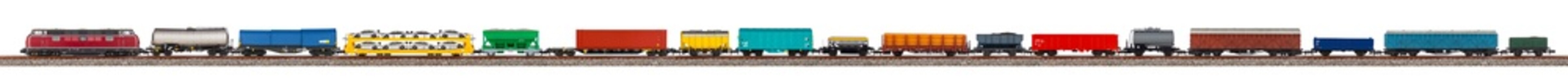 long model railway freight train with colorful wagon isolated white wide panorama background.  railroad hobby transportation logistic concept