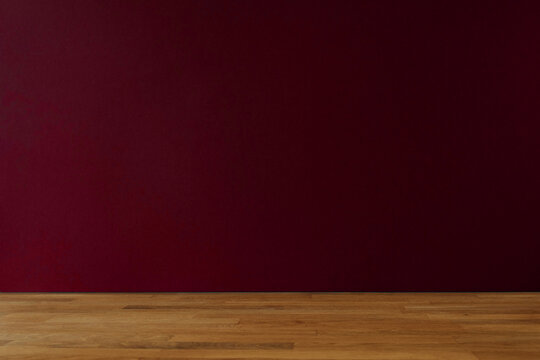 Dark red background for copy space and wooden table