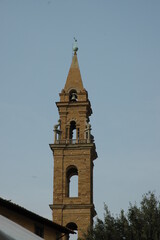 The church of Santo Spirito and its bell tower were designed by Brunelleschi in 1400 . With important works including Botticelli Perugino Raphael and a Crucifix by the young Michelangelo.