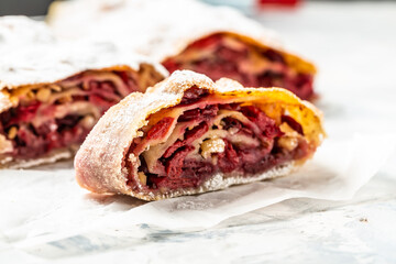 Strudel with a cherry. Cherry pie. winter dessert strudel with cherry, cranberries and walnut