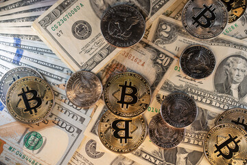 Bitcoin Cryptocurrency on US Dollar banknotes and coins. Trading Crypto with USD
