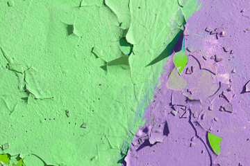 Colorful painted wall with peeling paint, cracks on the wall 