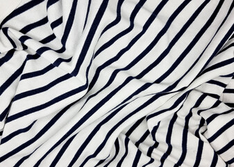 black and white pattern of cotton fabric use as background. close up of bent striped drapery. cltoth background for smooth, soft, minimal concept. template of gray cotton canvas in lines.