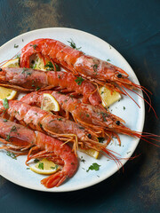 large cooked shrimp on a plate and space for text