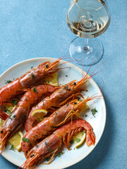 large cooked shrimp on a plate and space for text