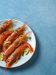 large cooked shrimp on a plate and space for text