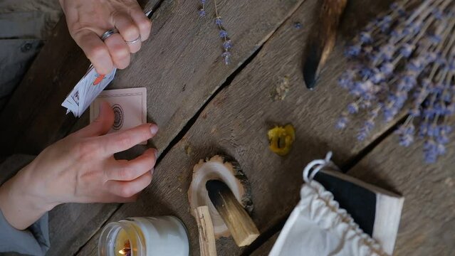 Tarot cards, Fortune telling on tarot cards magic crystal, occultism, Esoteric background. Fortune telling,tarot predictions.Fortune teller woman  tarot cards over white wooden table background.