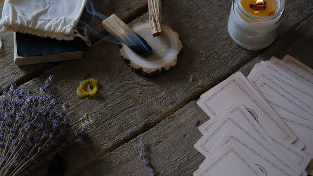 Tarot cards, Fortune telling on tarot cards magic crystal, occultism, Esoteric background. Fortune telling,tarot predictions.Fortune teller woman  tarot cards over white wooden table background.