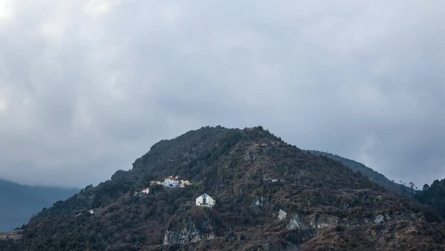 Timelapse of sunset at Tawang Monastery, Arunachal Pradesh, India. This timelapse captures the Tawang monastery nestled in the lush mountains with the changing lightscape from sunrise to sunset.