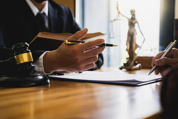 Attorneys or lawyers who are reading the statute of limitations Consultation between male lawyers and business clients, tax and legal and legal services firms.