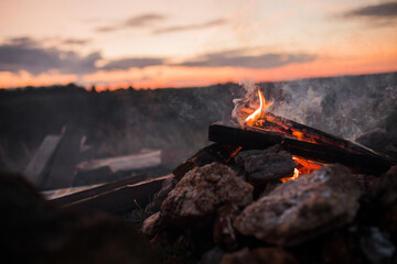 bonfire made of firewood and stones close-up