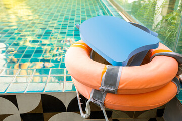 Foam board and pool rings for the teaching of swimming beside swimming pool.
