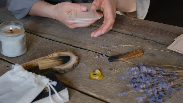 Tarot cards, Fortune telling on tarot cards magic crystal, occultism, Esoteric background. Fortune telling,tarot predictions.Fortune teller woman  tarot cards over white wooden table background.