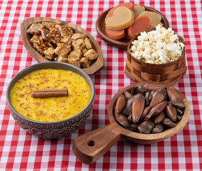 Typical brazilian june festival food over red plaid fabric. Festa junina